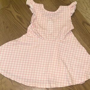 Busy Bees Smock Pink Gingham dress Embroidered with a C on the front.